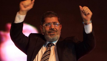 Morsi vows to go ahead with referendum